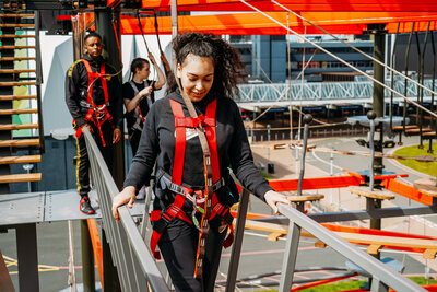 Person walking on a high ropes course