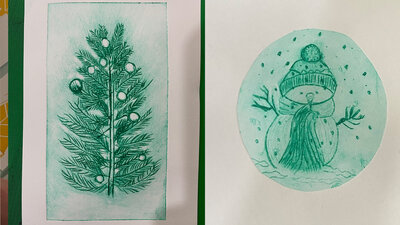 Two green Christmas prints in a book