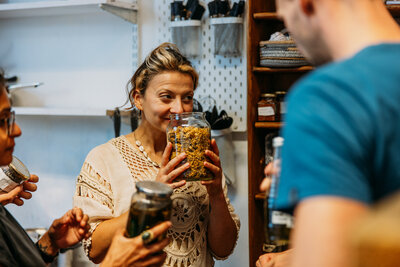 Guests smelling natural ingredients use to dye fabrics 