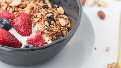 Yogurt served with granola, fruits and honey