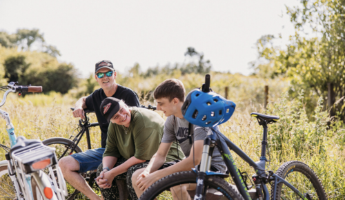 Family bike ride - sat on bench