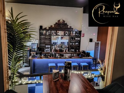 Cosy wine bar with twinkling lights and inviting atmosphere.