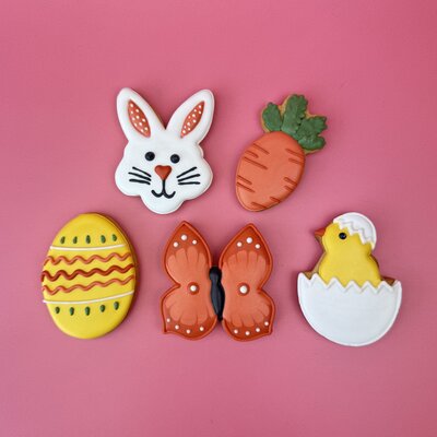 Playful Easter-themed biscuits on a pink backdrop