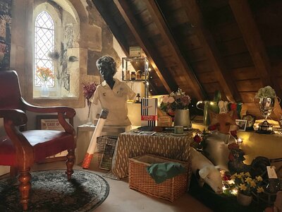 Cosy attic nook with eclectic decor and vintage charm.