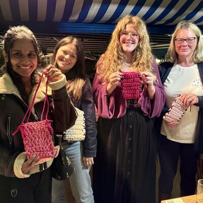 Joyful crafters showing off their handmade bags