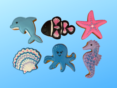 Charming sea creature biscuits on a blue backdrop.