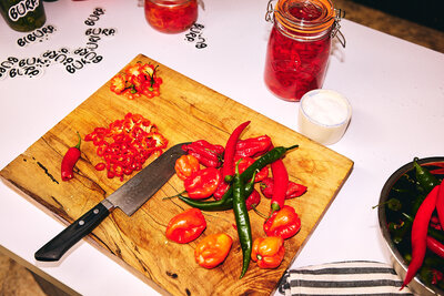 Spicy pepper prep on a wooden board, ready to sizzle!