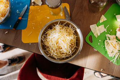 Bowl of shredded cheese and veggies ready for chopping fun!