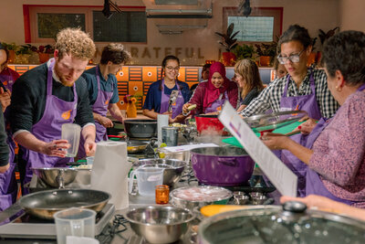 Cooking class fun: A lively group enjoying a hands-on culinary adventure.