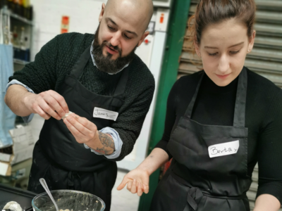 Friendly duo enjoying a hands-on cooking session
