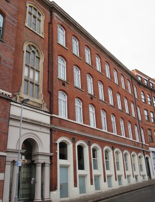 Charming red-brick building with archway entrance