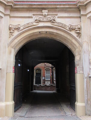 Charming historic archway leading to a hidden courtyard adventure