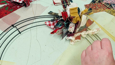 Crafting a vibrant festive wreath with colourful fabric scraps