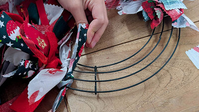 Crafting a festive wreath with colourful fabric strips
