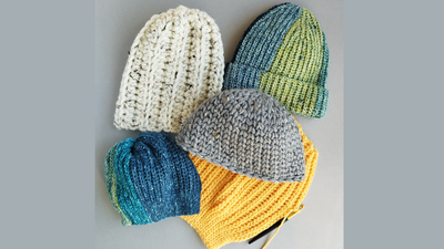 Cosy knitted hats in cheerful colours ready for winter warmth.