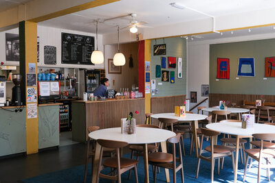 Cosy café with colourful art and welcoming vibe