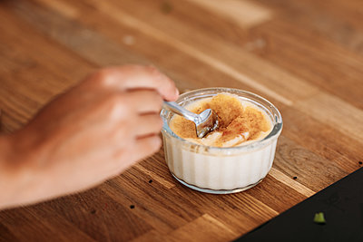Guest inserts a spoon into their potted dessert